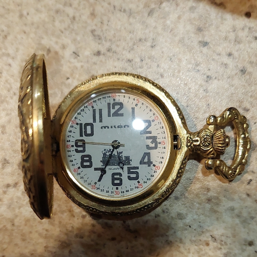 Gold Pocket Watch with Intricate Design